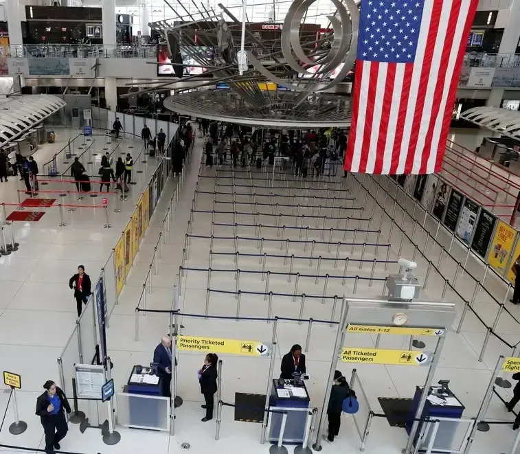 Customs agent in the United States reviewing files and export documentation.