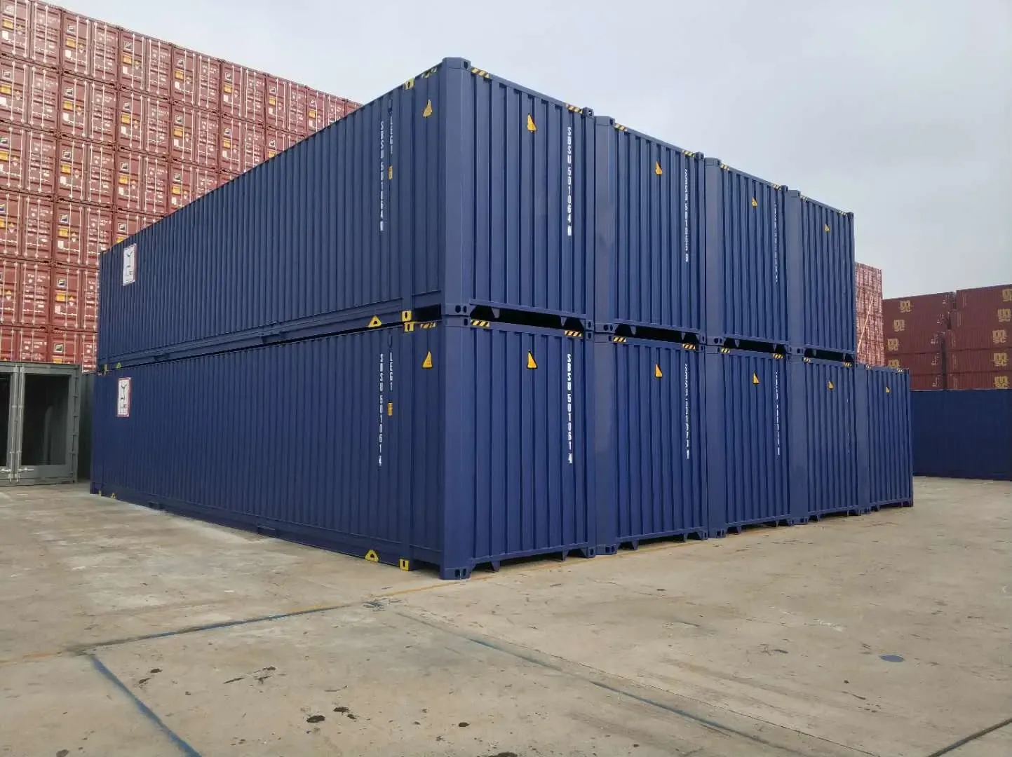 Stack of blue Pallet Wide containers with greater internal width.