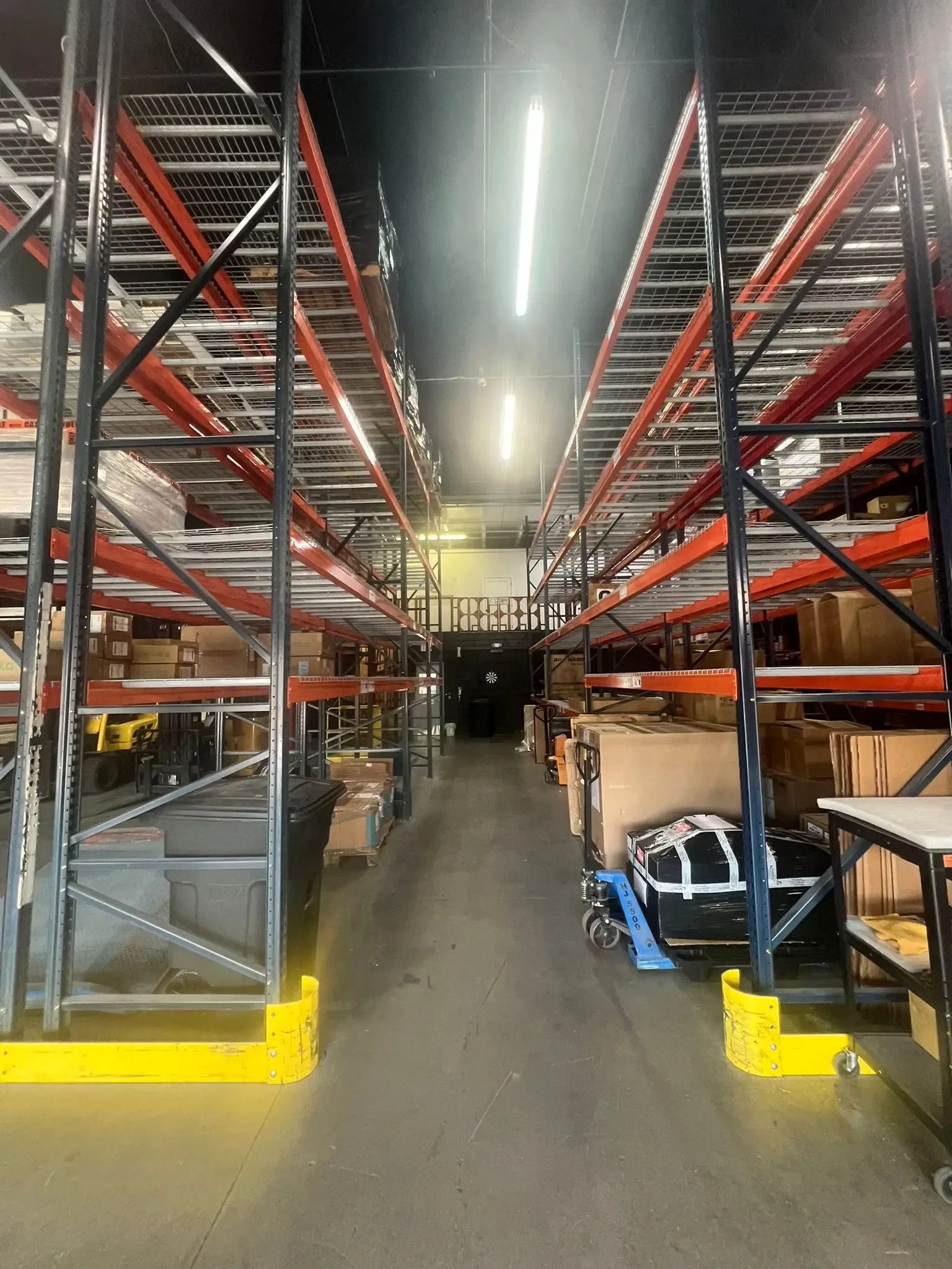 Close-up of the box sealing process with adhesive tape to secure cargo in storage.