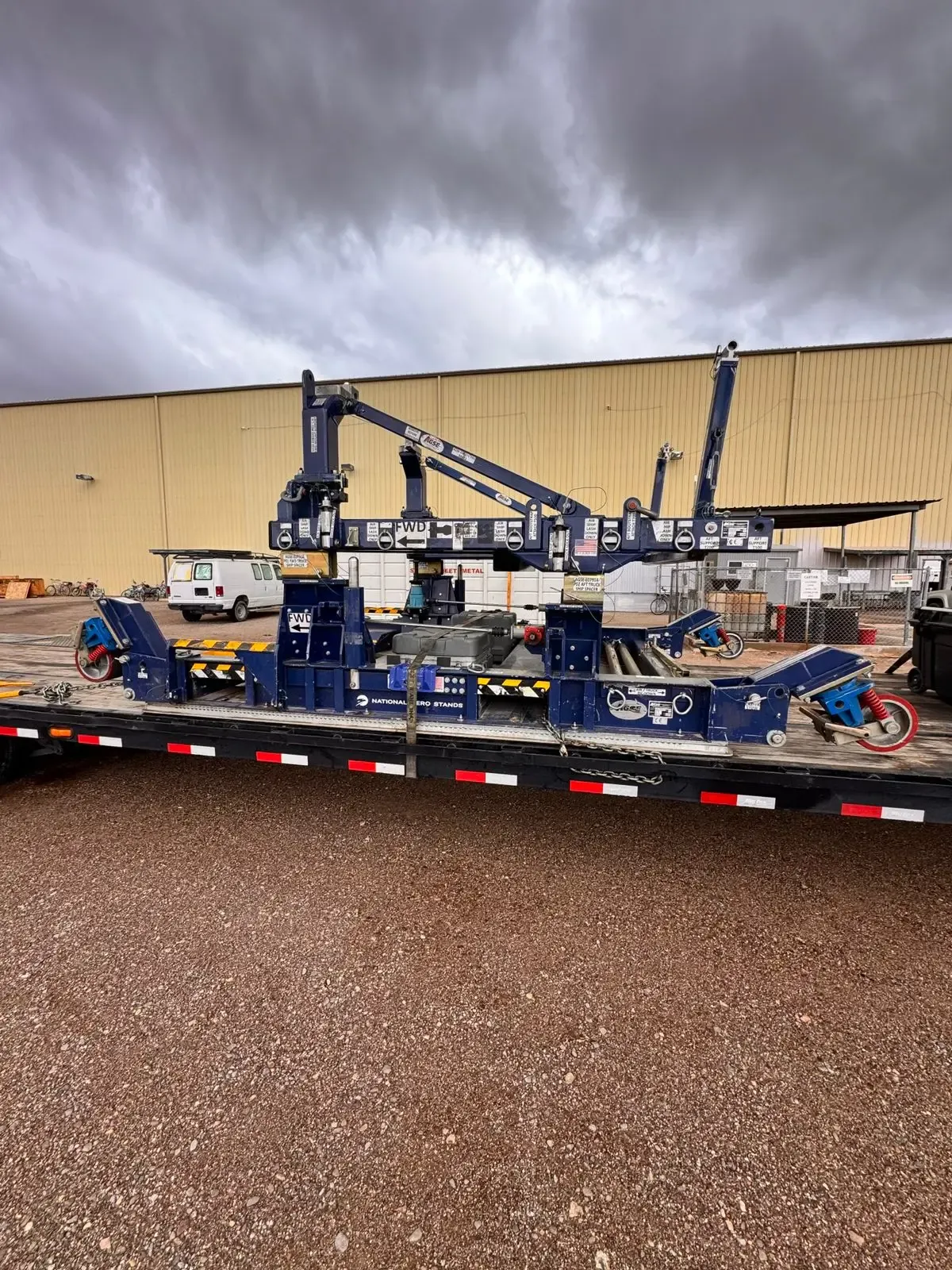 Heavy industrial support equipment mounted on a specialized transport platform.